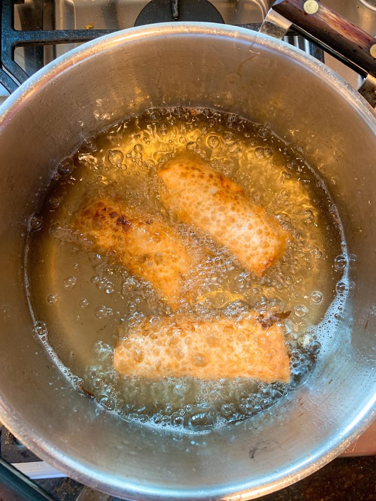 Egg Rolls Frying in Oil | Dishin' With Darla